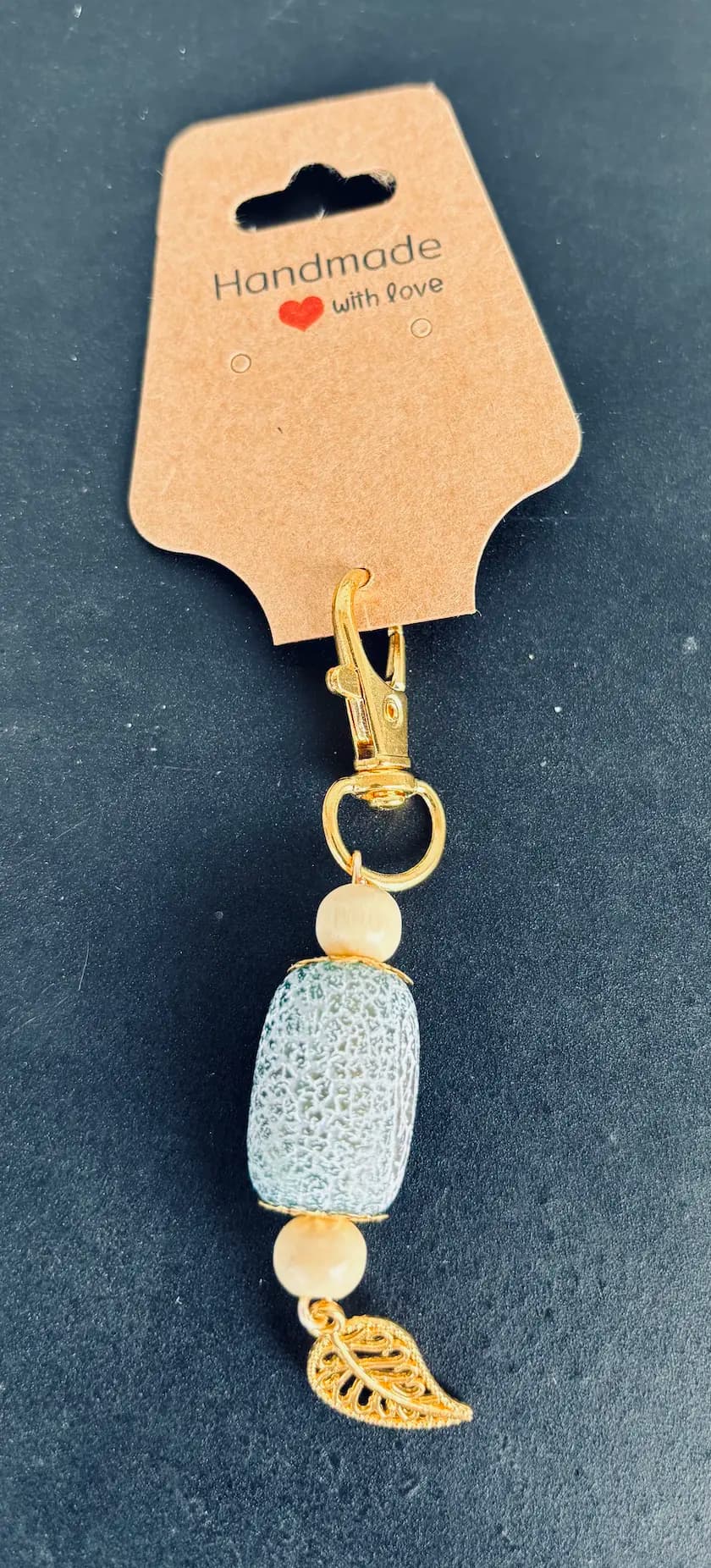 Frosted agate bead charm with a gold leaf