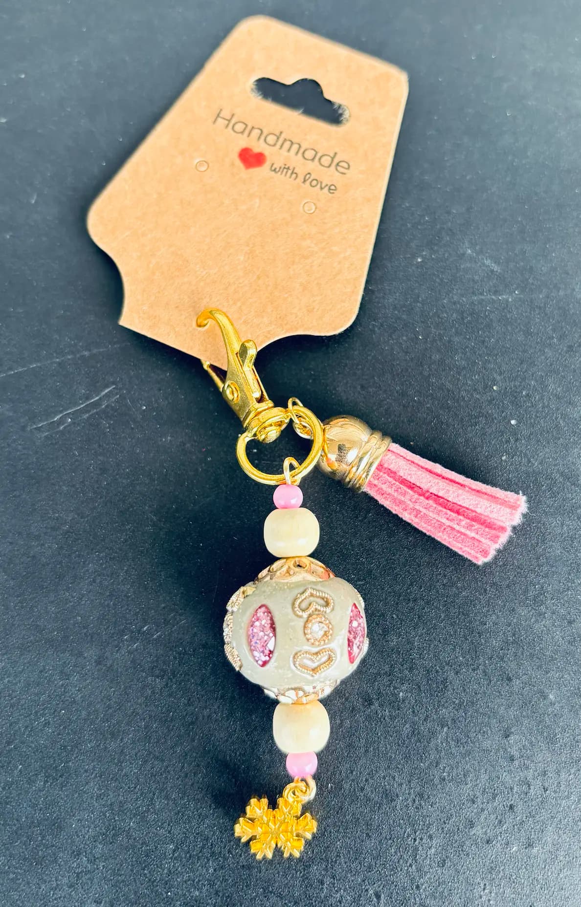 Rose tassel charm with a gilded bead