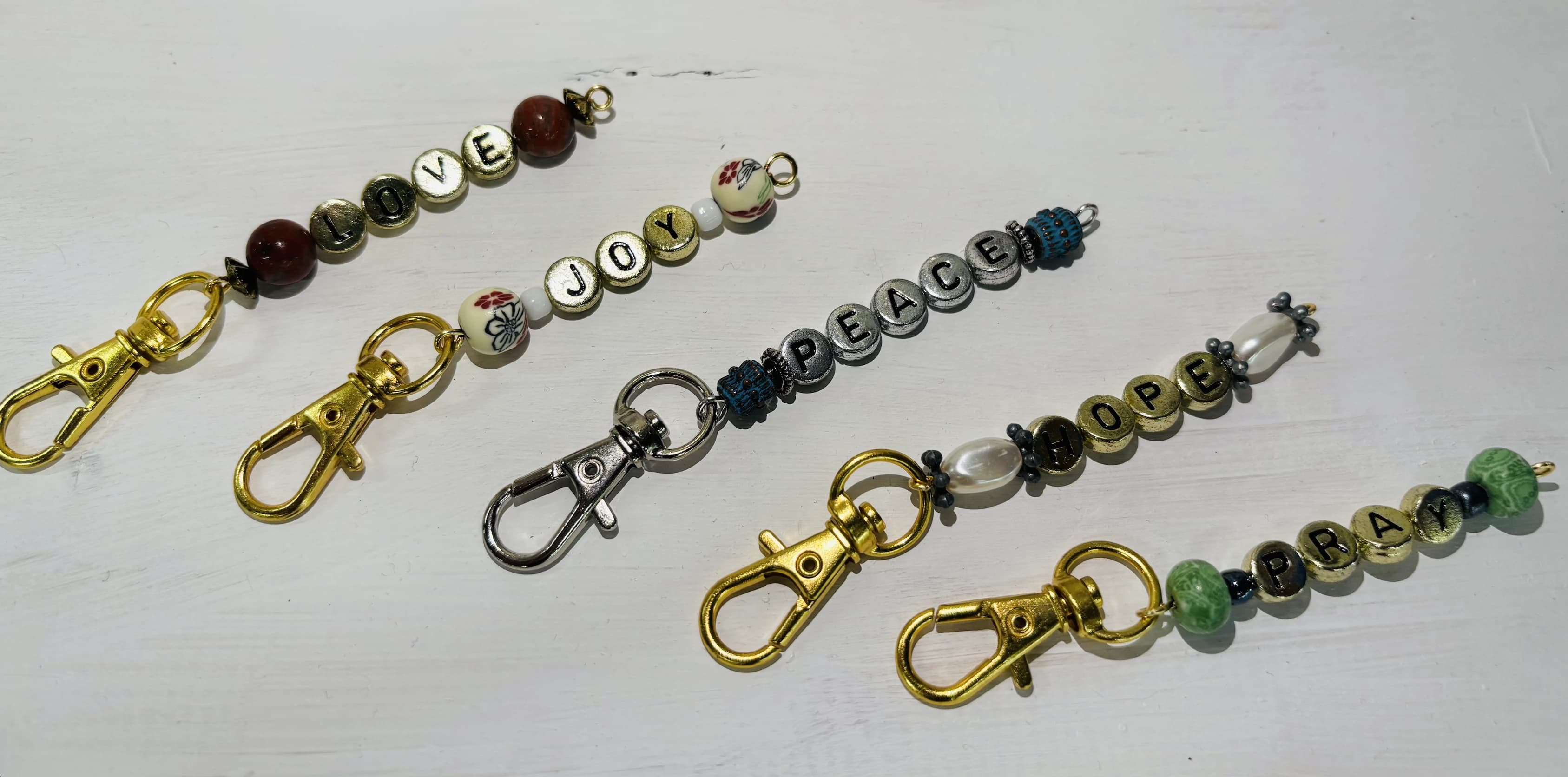 Word charms spelling LOVE, JOY, PEACE, HOPE and PRAY